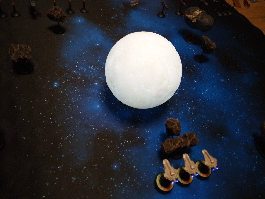 Star Alliance cruisers waiting behind the moon.